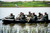 Members of 817th Sapper Company arrive in Zodiak boats on opposite side of Pipestem Lake outside of Jamestown, N.D.