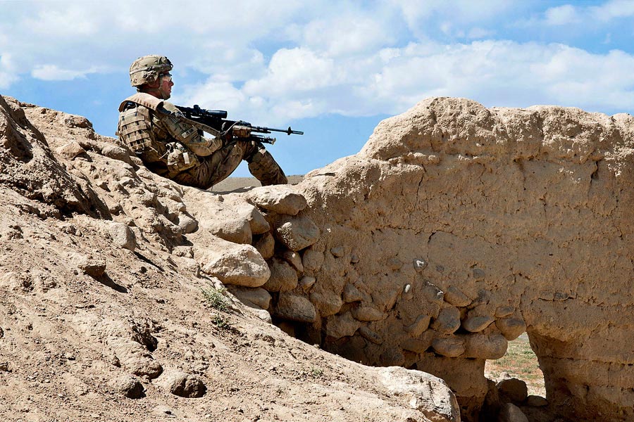 Paratrooper with 82nd Airborne Division, armed with an M-14 Enhanced Battle Rifle, pulls security