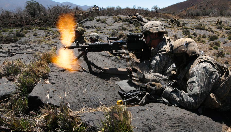 Soldiers from 25th Infantry Division, provide suppressive fire on target during training exercise