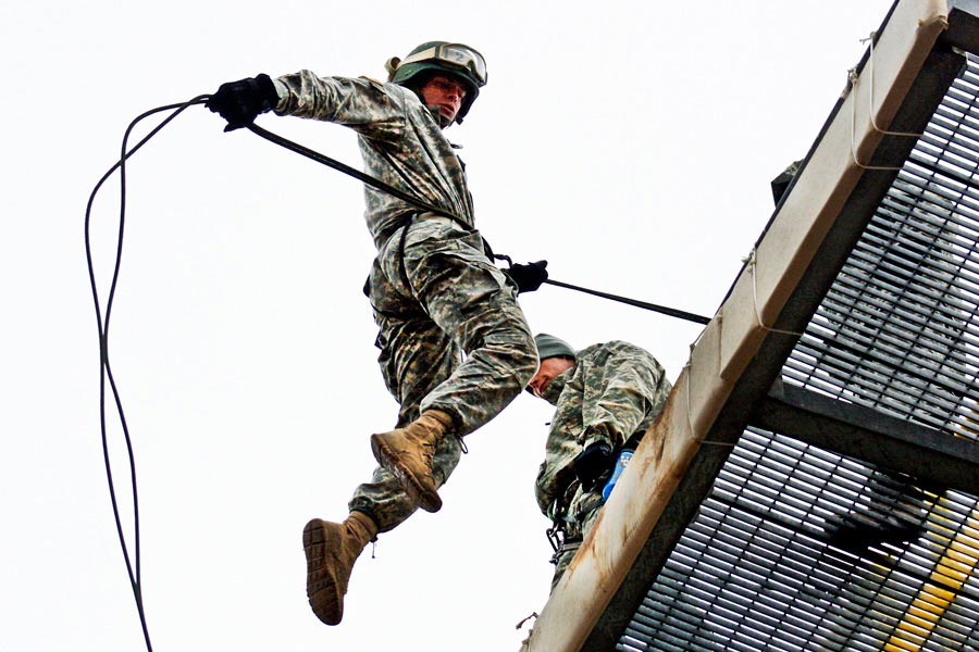 Missouri National Guardsman Cadet Andrew Cully leaps from top of rappel tower