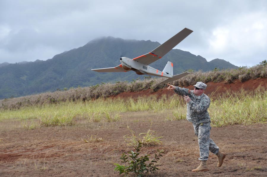 Sergeant Michael Tacket, with 25th Infantry Division, launches Tier I Small Unmanned Aerial Vehicle 'PUMA,' during training