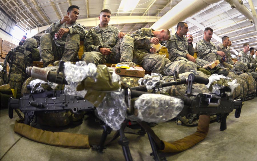 Paratroopers from 82nd Airborne Division, relax with some chow. prior to an airborne operation