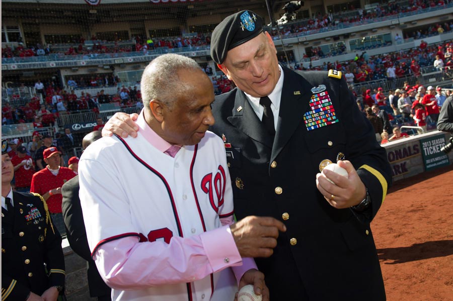 Army Chief of Staff General Raymond T. Odierno shows baseball to Hall of Famer Frank Robinson