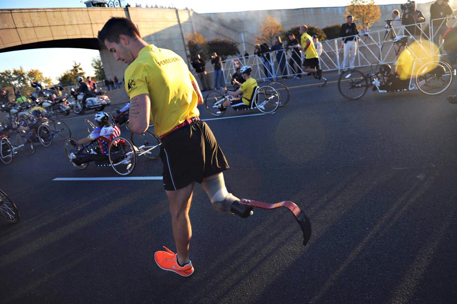 Wounded Warriors participate in the 2012 Army Ten Miler with hand-cycles