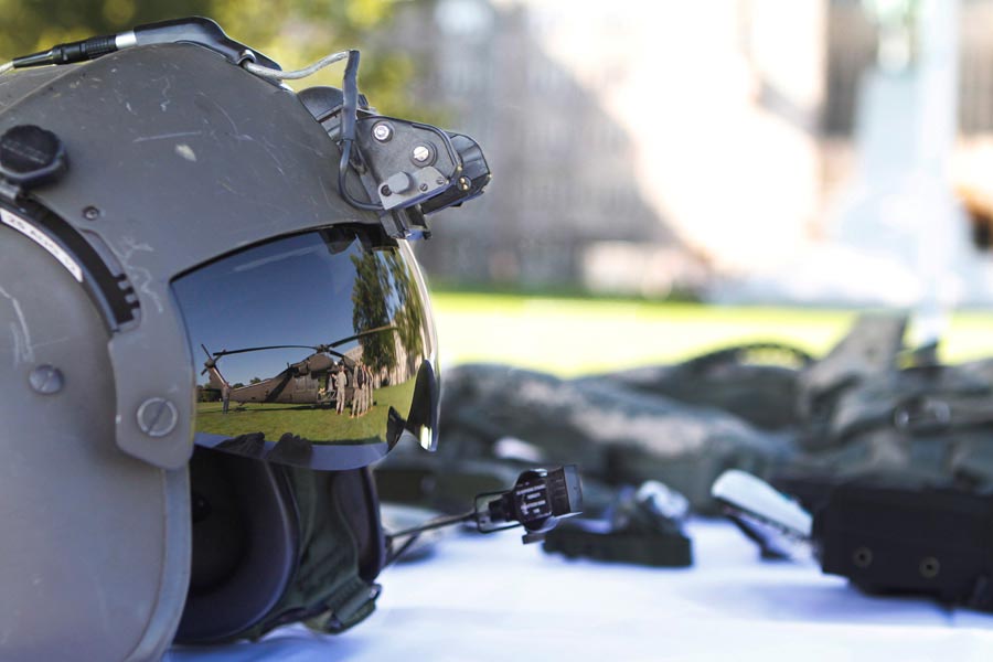 UH-60L Black Hawk helicopter reflected in pilot's helmet