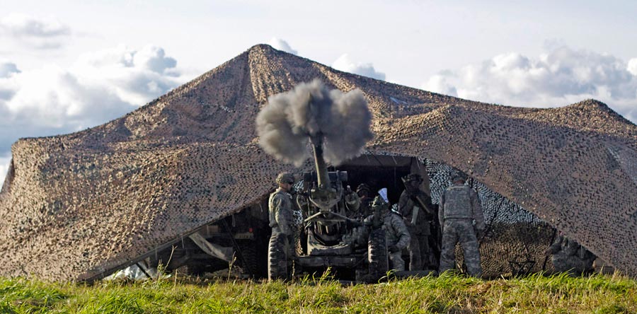 Artillerymen in 25th Artillery Regiment, fire howitzer during fire support certification exercise