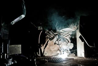 Specialist Brady Myatt, 172nd Infantry Brigade, demonstrates basic welding techniques for his partnered trainees