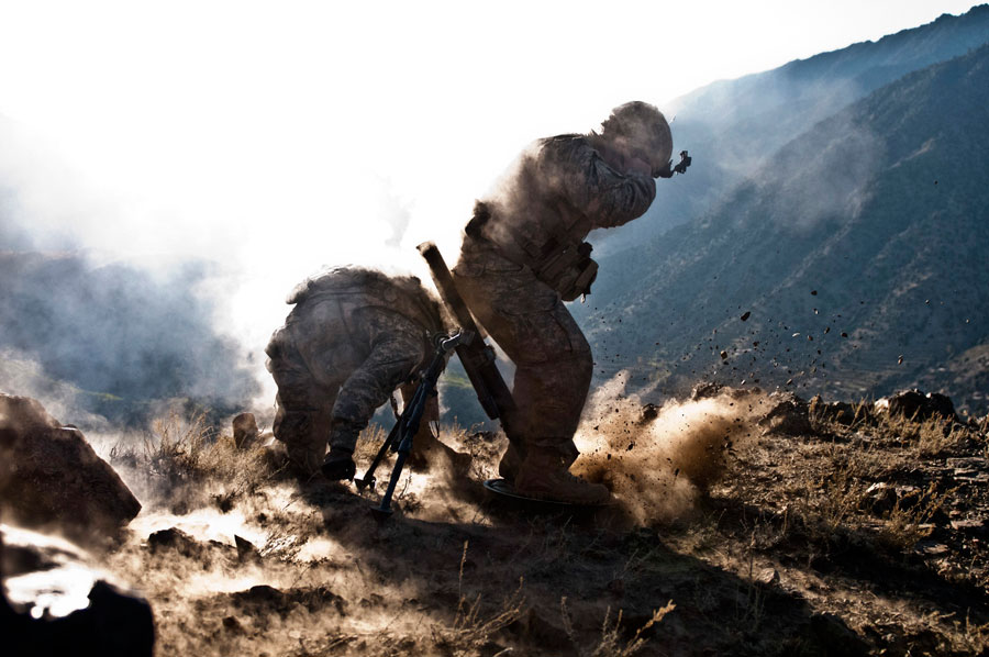 A mortar man fires mortars