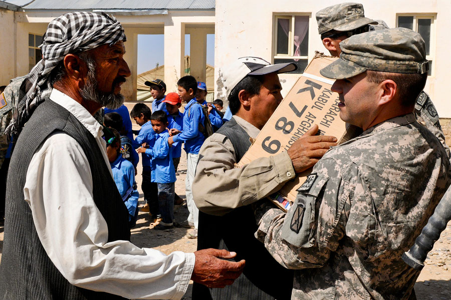 United States and Afghan Soldiers visited Aliabad school to deliver school supplies