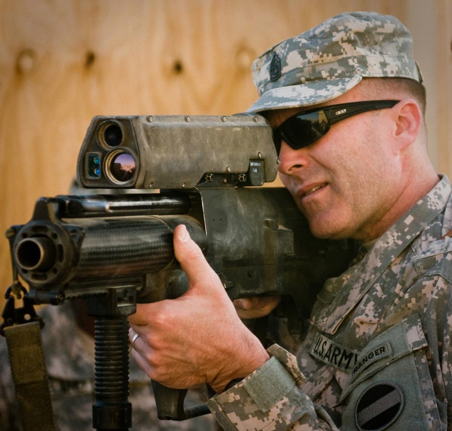 Command Sergeant Major Ronald T. Riling looks through scope of an XM-25 Individual Airburst Weapon System