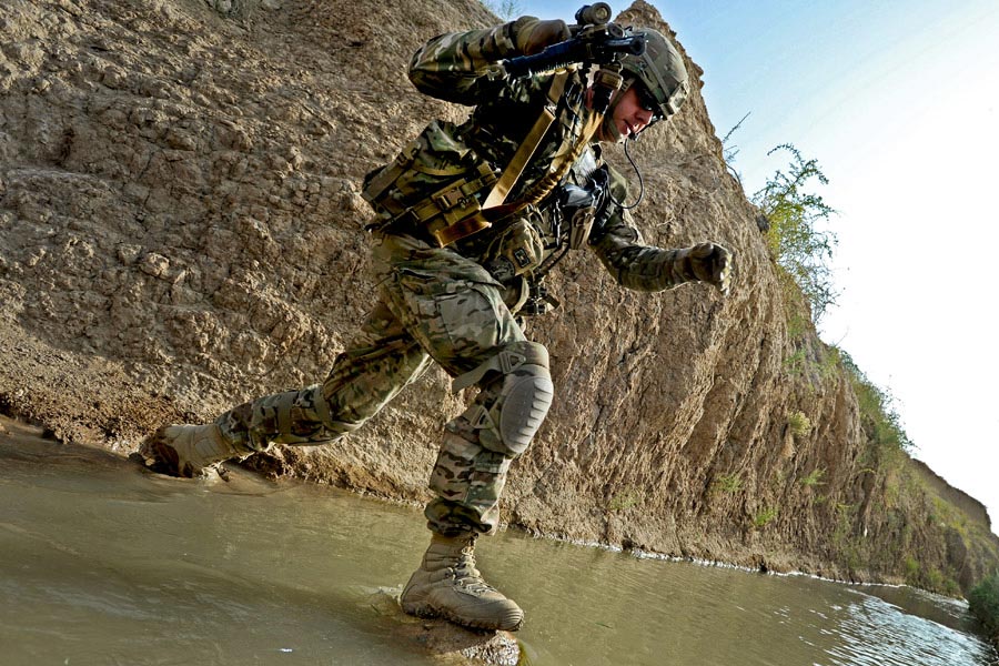 Sergeant First Class Robert Russell crosses the Tarnek River in Qalat City, Afghanistan