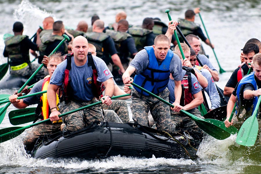 Captain Michael Natalino leads his men across Fort Bragg’s Kiest Lake to commemorate the Allied crossing of the Waal River near Nijmegen during World War II